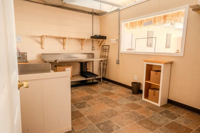 a kitchen with a sink and wooden cabinets