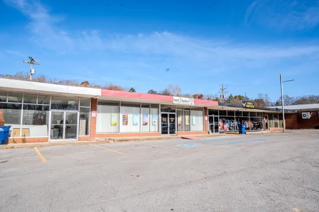 a front view of a building with many windows