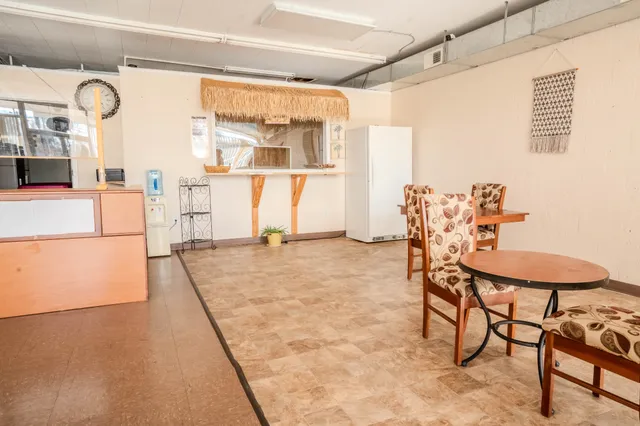 a lobby with furniture and a table