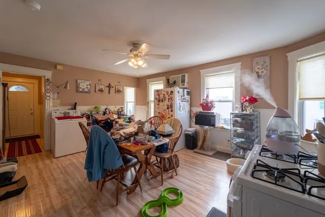 a view of a dining room with furniture window and wooden floor