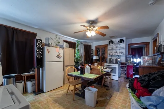 a outdoor dining space with furniture and a chandelier