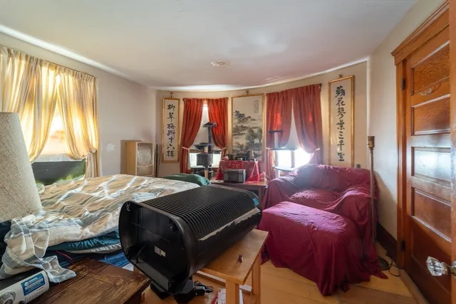 a bed room with a bed and a window