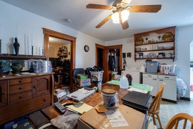 a living room with furniture a rug and a window