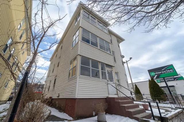 a view of a house with a tree