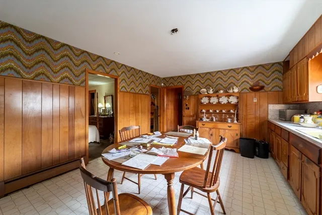 a view of a dining room with furniture and window