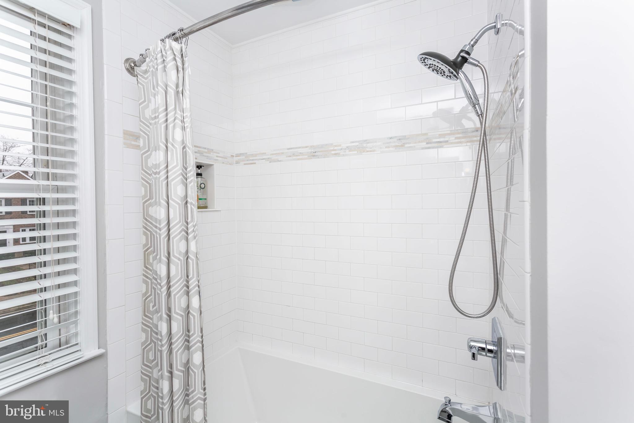 236 Stanmore Road Baltimore, MD 21212 - Photo 22 of 51 a bathroom with a glass shower door