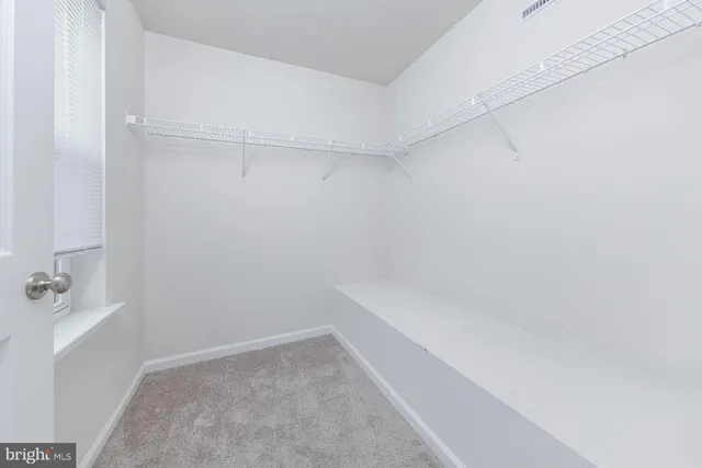 a utility room with cabinets washer and dryer