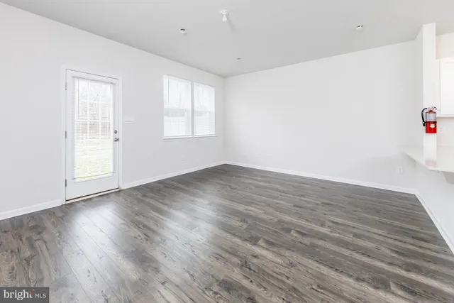 a kitchen with stainless steel appliances a refrigerator sink and microwave