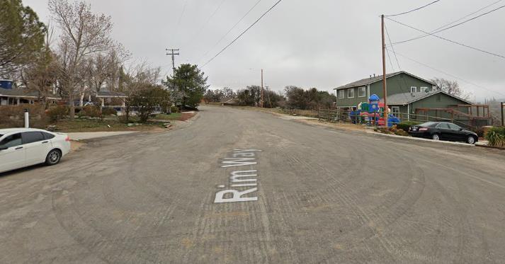 22948 Rim Way Tehachapi, CA 93561 - Photo 7 of 16 a view of street with parked cars