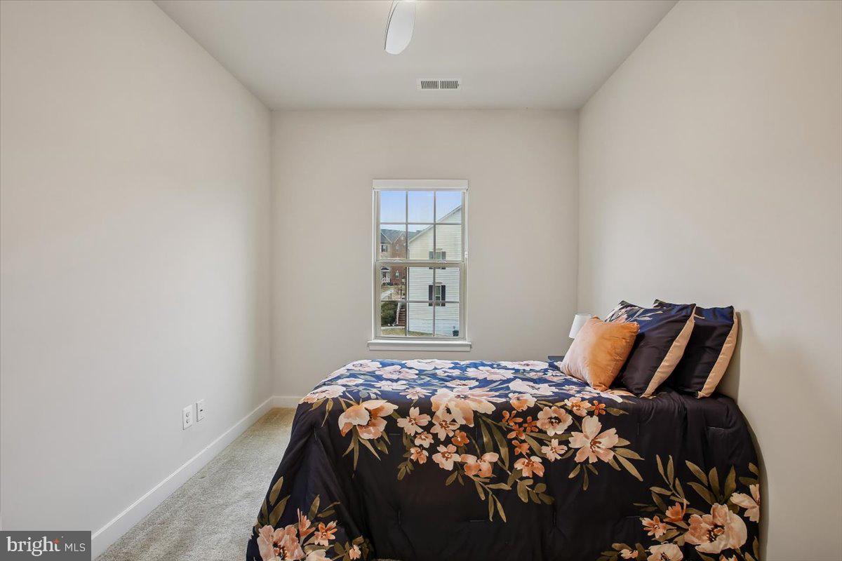 2105 Hemlock Bay Road Dumfries, VA 22026 - Photo 15 of 48 a bedroom with a bed and window