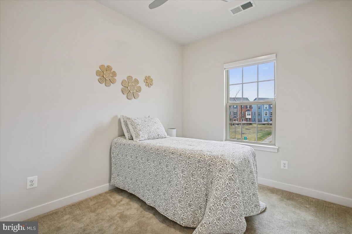 2105 Hemlock Bay Road Dumfries, VA 22026 - Photo 17 of 48 a bedroom with a bed and a window