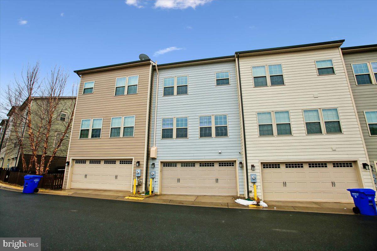 2105 Hemlock Bay Road Dumfries, VA 22026 - Photo 26 of 48 a front view of a house with a yard