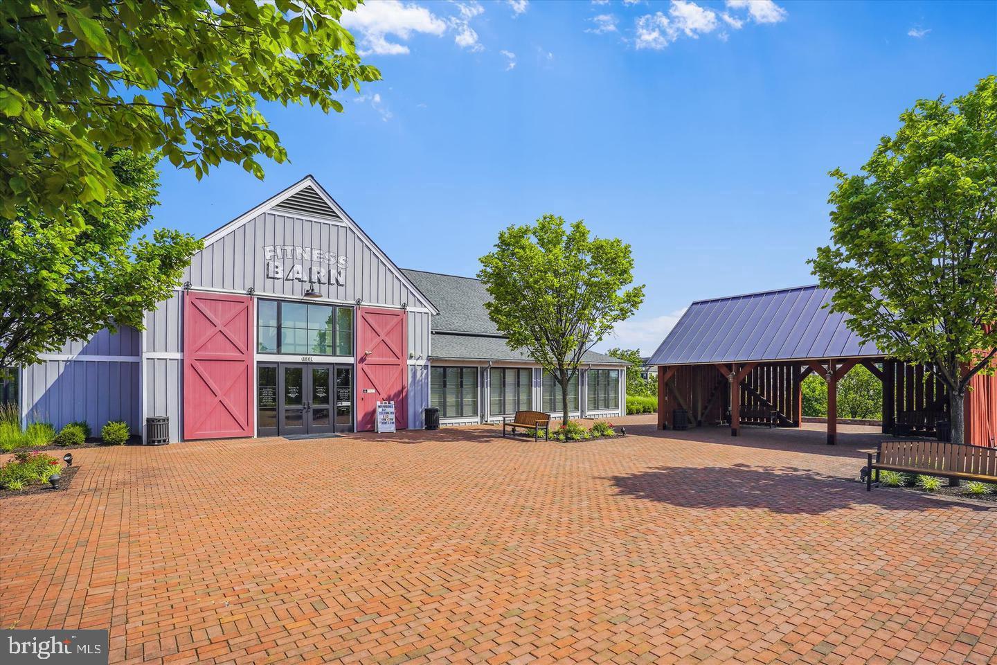 2105 Hemlock Bay Road Dumfries, VA 22026 - Photo 37 of 48 a front view of a house with a yard
