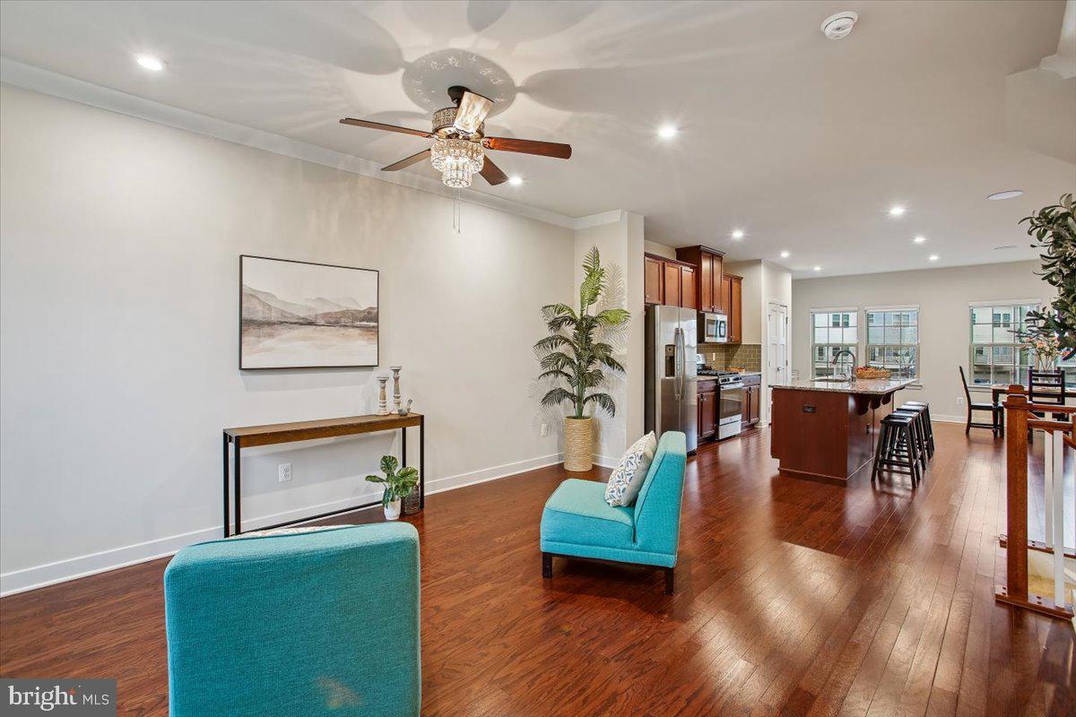 2105 Hemlock Bay Road Dumfries, VA 22026 - Photo 48 of 48 a living room with furniture and wooden floor