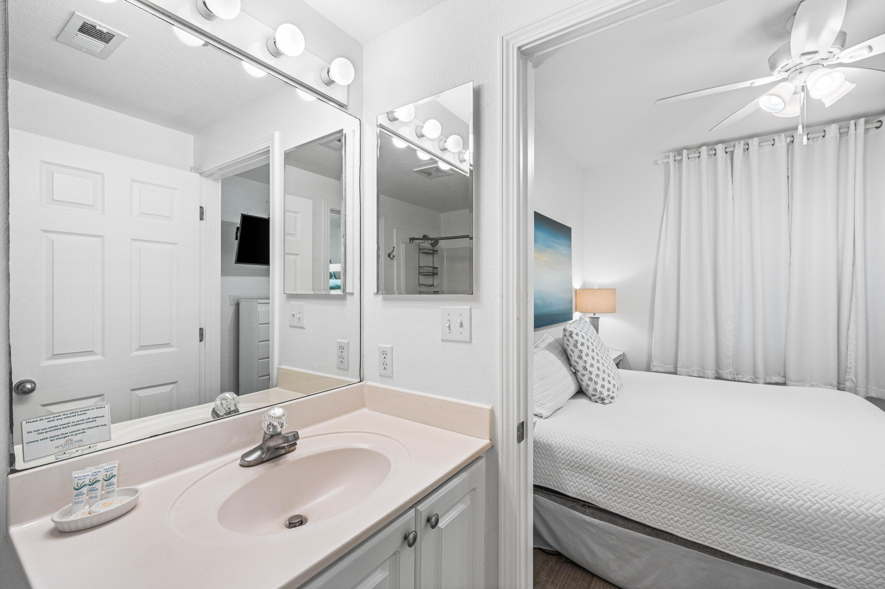 145 Spires Lane, Unit 306 Santa Rosa Beach, FL 32459 - Photo 11 of 35 a bedroom with a sink and a mirror