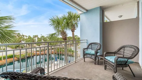 a view of a balcony with chairs