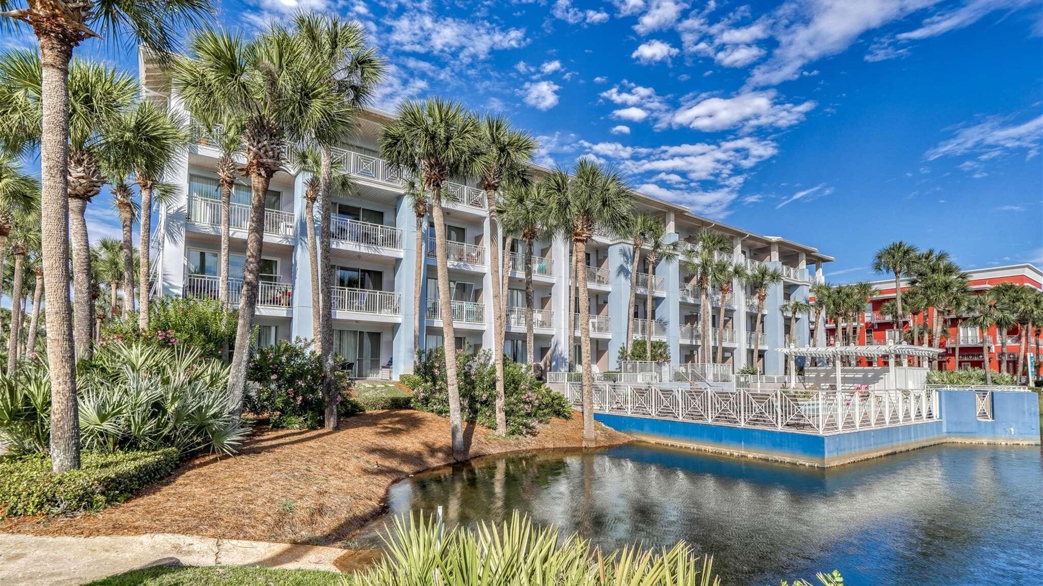 145 Spires Lane, Unit 306 Santa Rosa Beach, FL 32459 - Photo 24 of 35 a view of balcony with swimming pool and plants