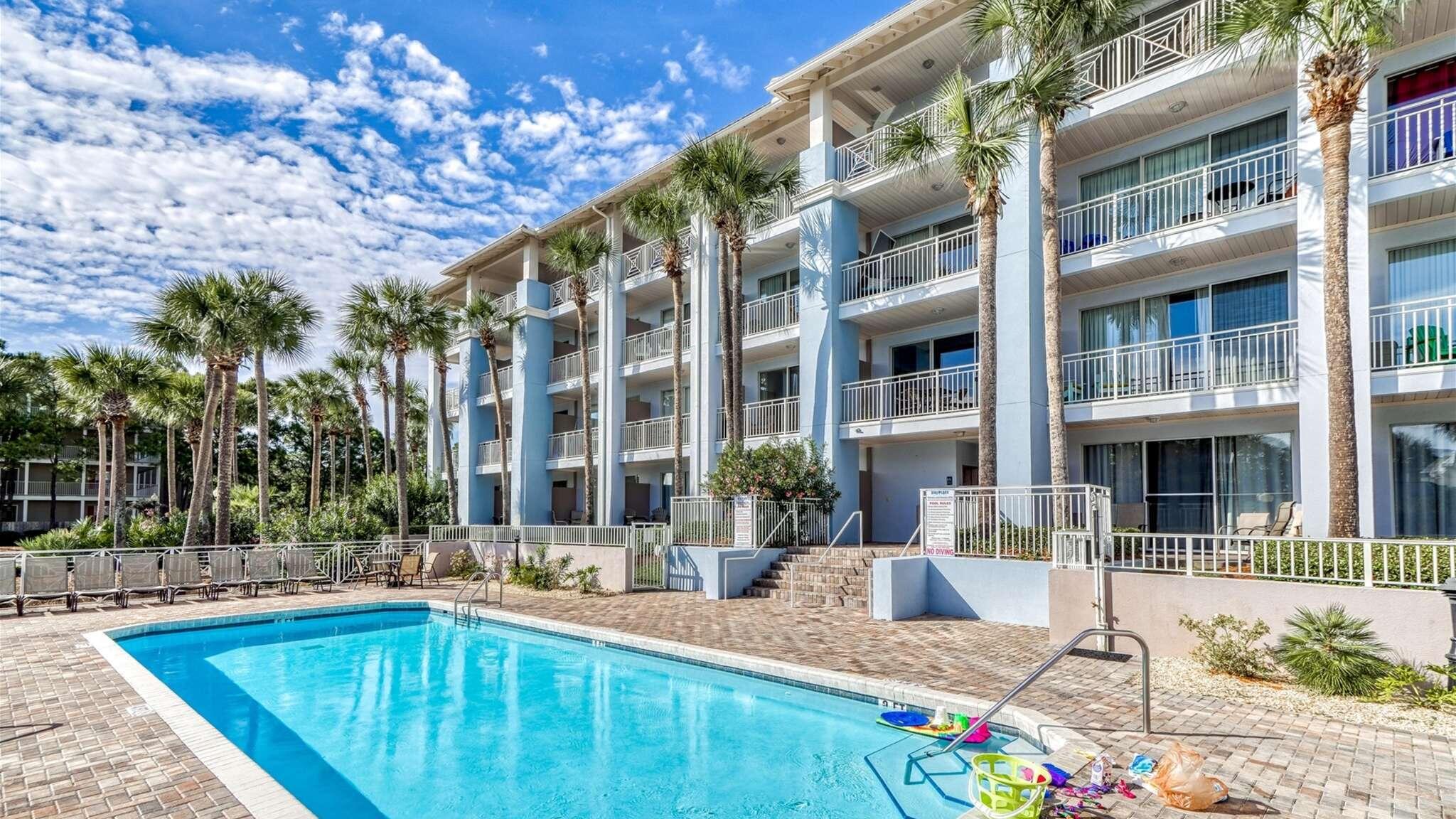 145 Spires Lane, Unit 306 Santa Rosa Beach, FL 32459 - Photo 29 of 35 a view of a house with swimming pool and sitting area