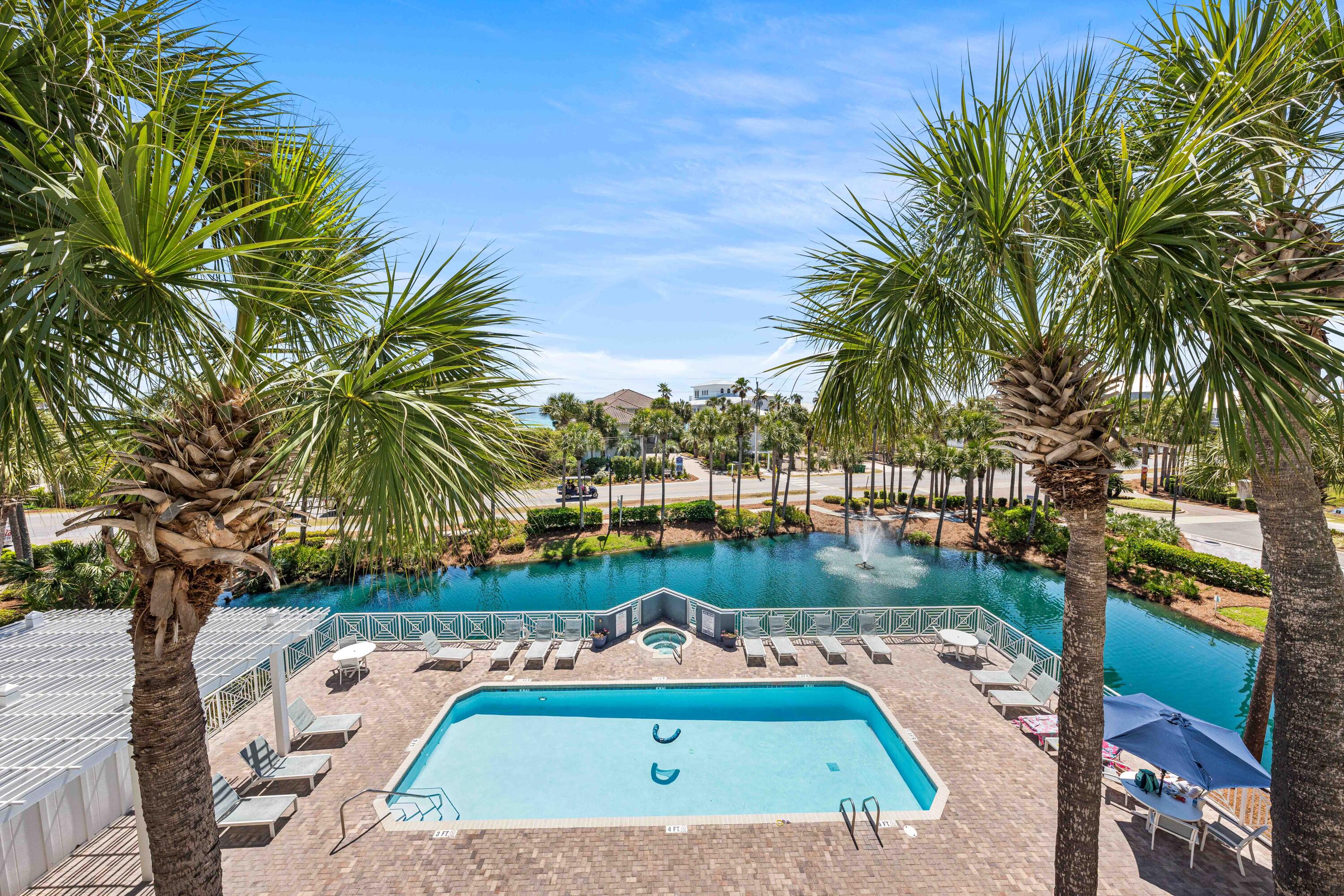 145 Spires Lane, Unit 306 Santa Rosa Beach, FL 32459 - Photo 32 of 35 a view of a swimming pool with a yard and sitting area