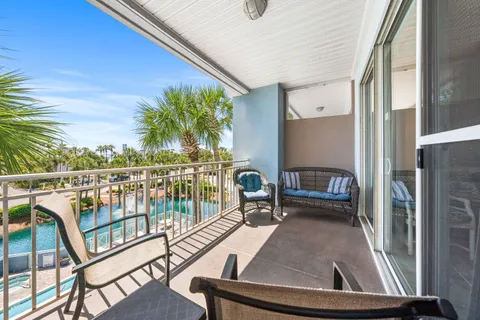a view of a balcony with chairs