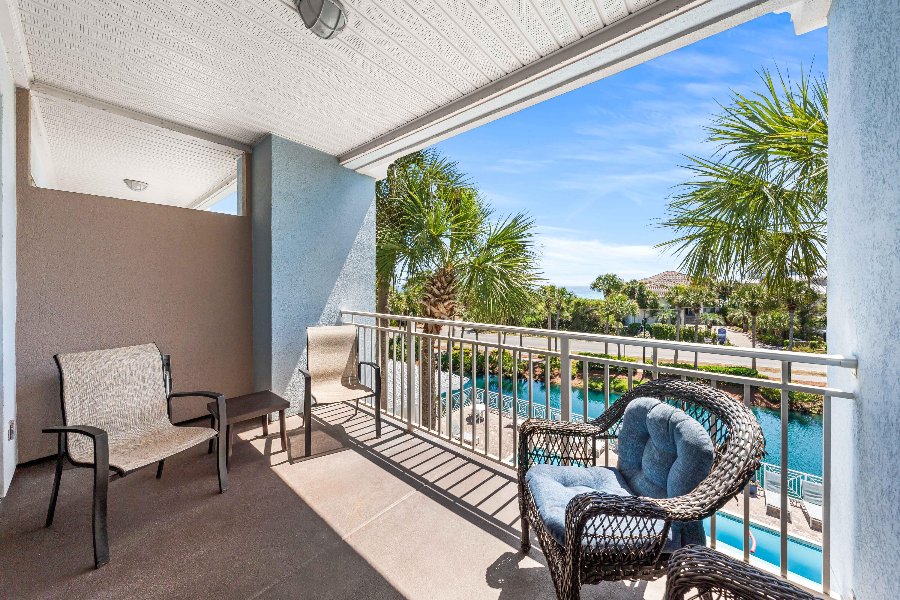 145 Spires Lane, Unit 306 Santa Rosa Beach, FL 32459 - Photo 35 of 35 a balcony with outdoor seating and plants