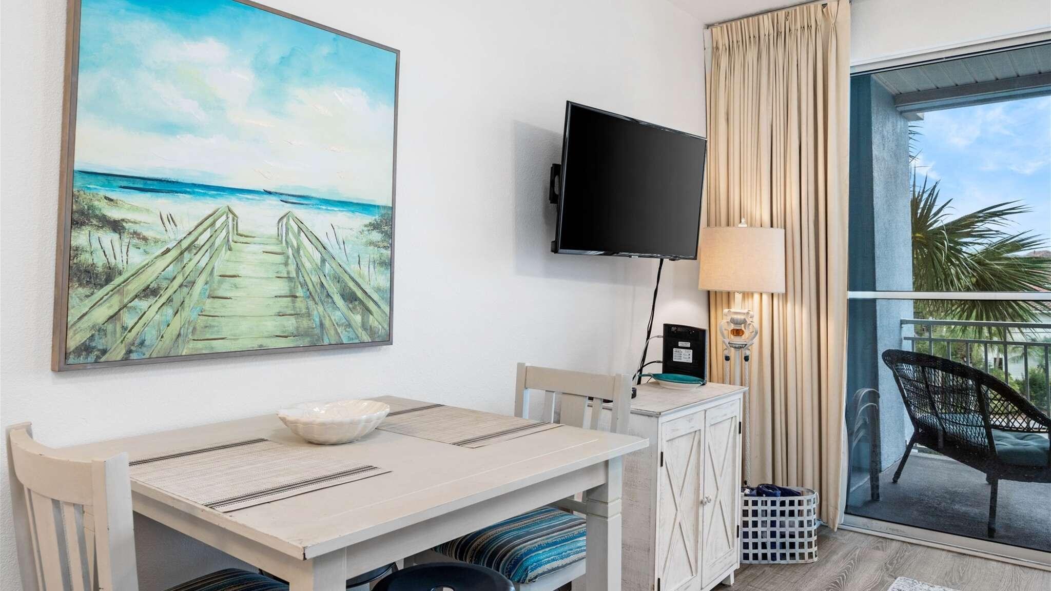 145 Spires Lane, Unit 306 Santa Rosa Beach, FL 32459 - Photo 5 of 22 a view of a workspace with furniture and a flat screen tv