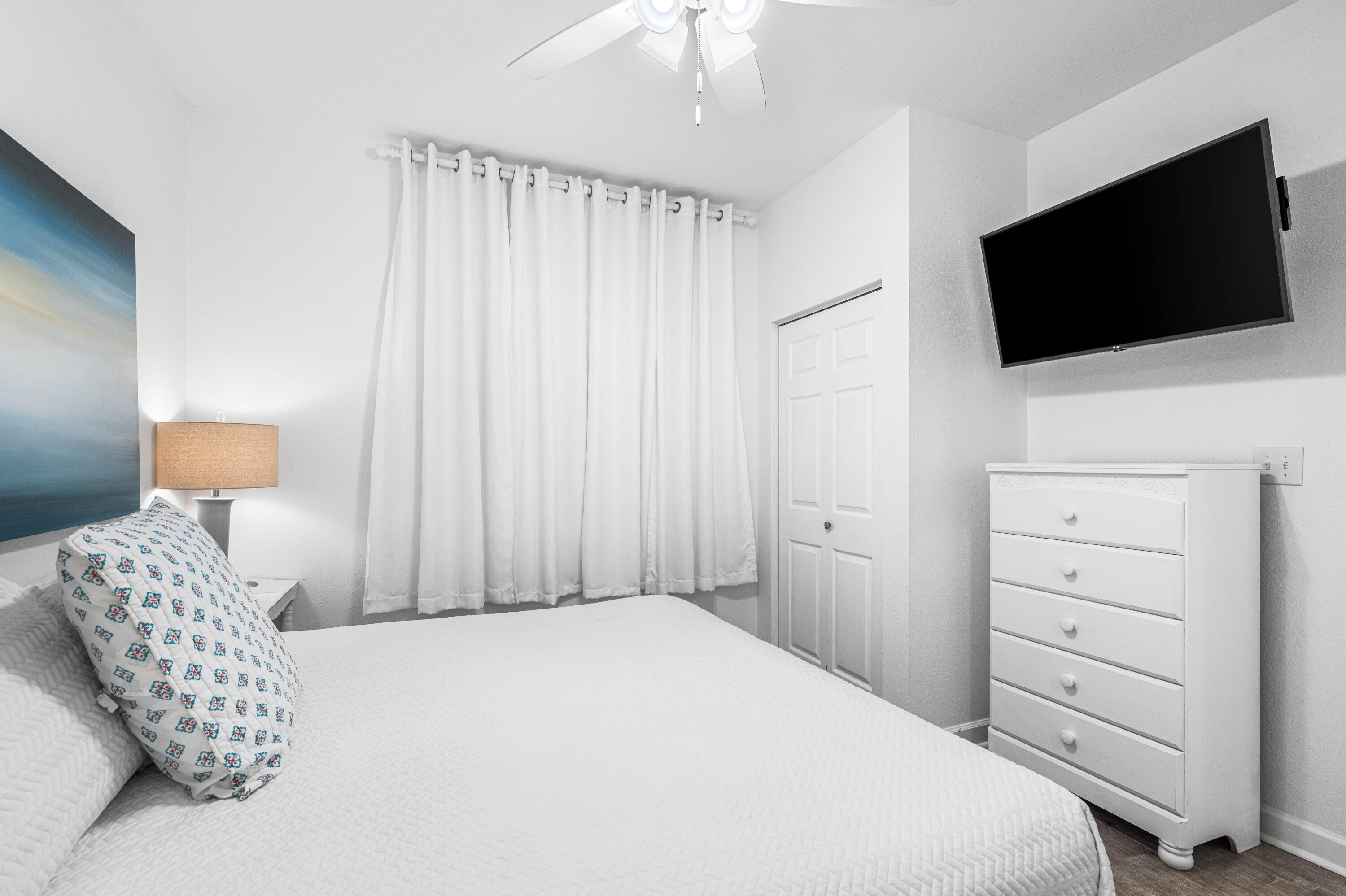 145 Spires Lane, Unit 306 Santa Rosa Beach, FL 32459 - Photo 9 of 35 a bedroom with a flat screen tv and a bed