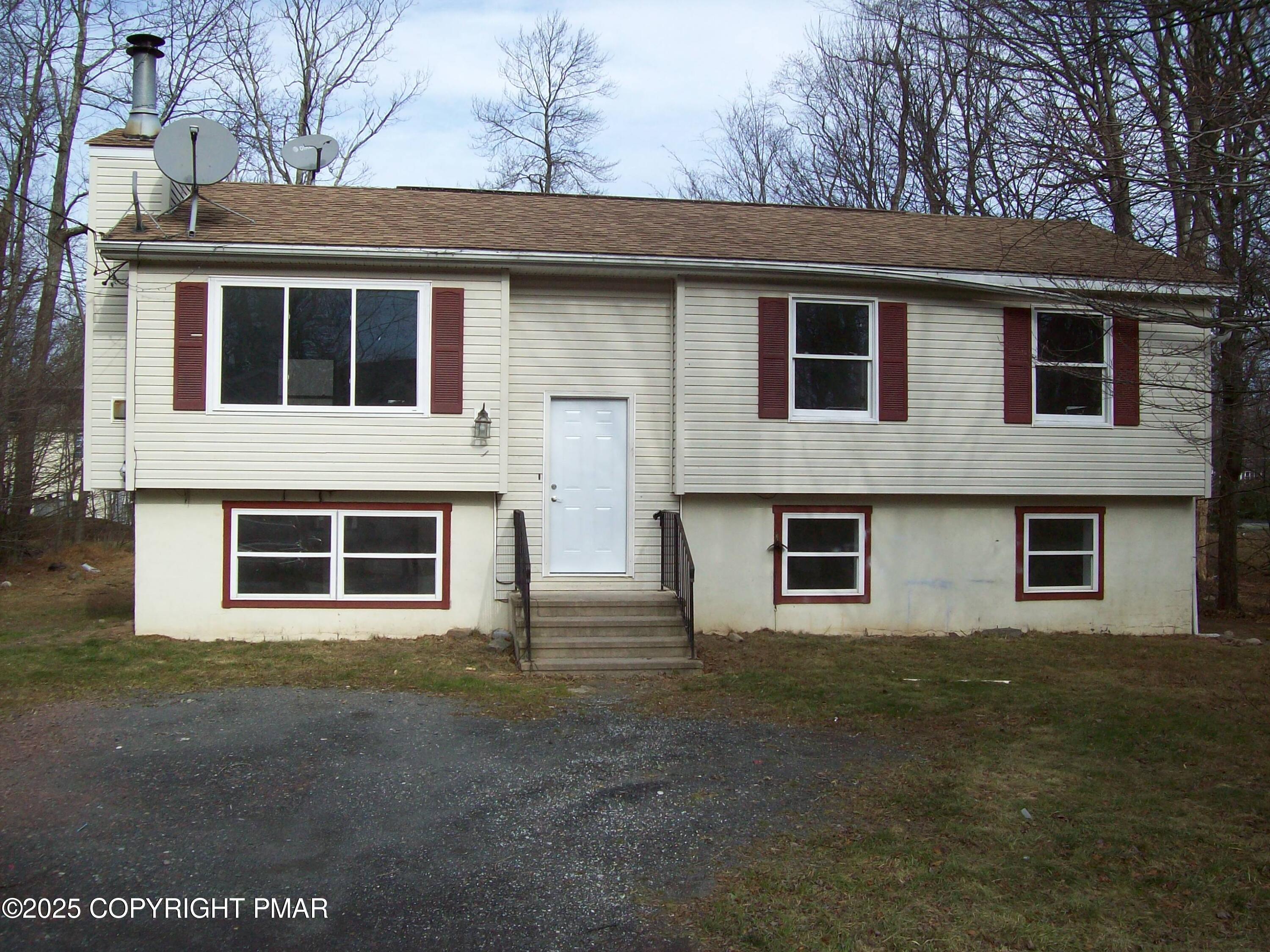 4161 Romeo Road Tobyhanna, PA 18466 - Photo 2 of 25 a house that has a window in front of it
