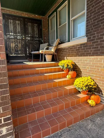 a view of a chairs and table in a patio
