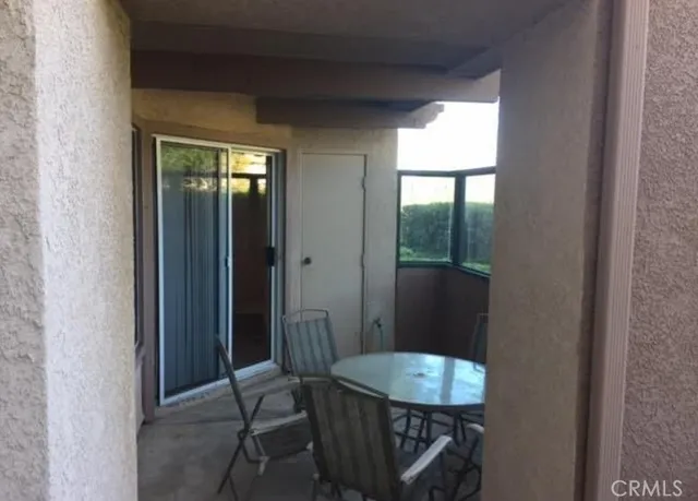 a view of a hallway and dining room