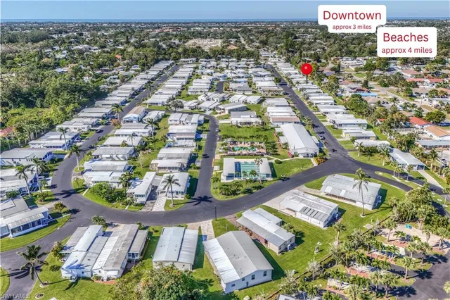 an aerial view of a house with a garden and swimming pool
