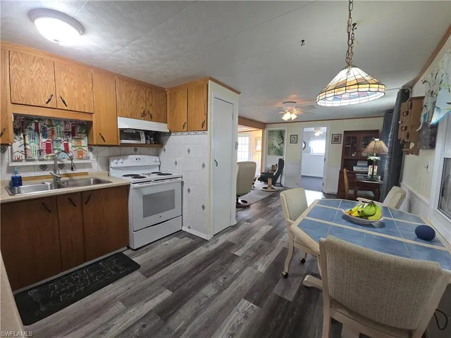 a kitchen with cabinets and appliances
