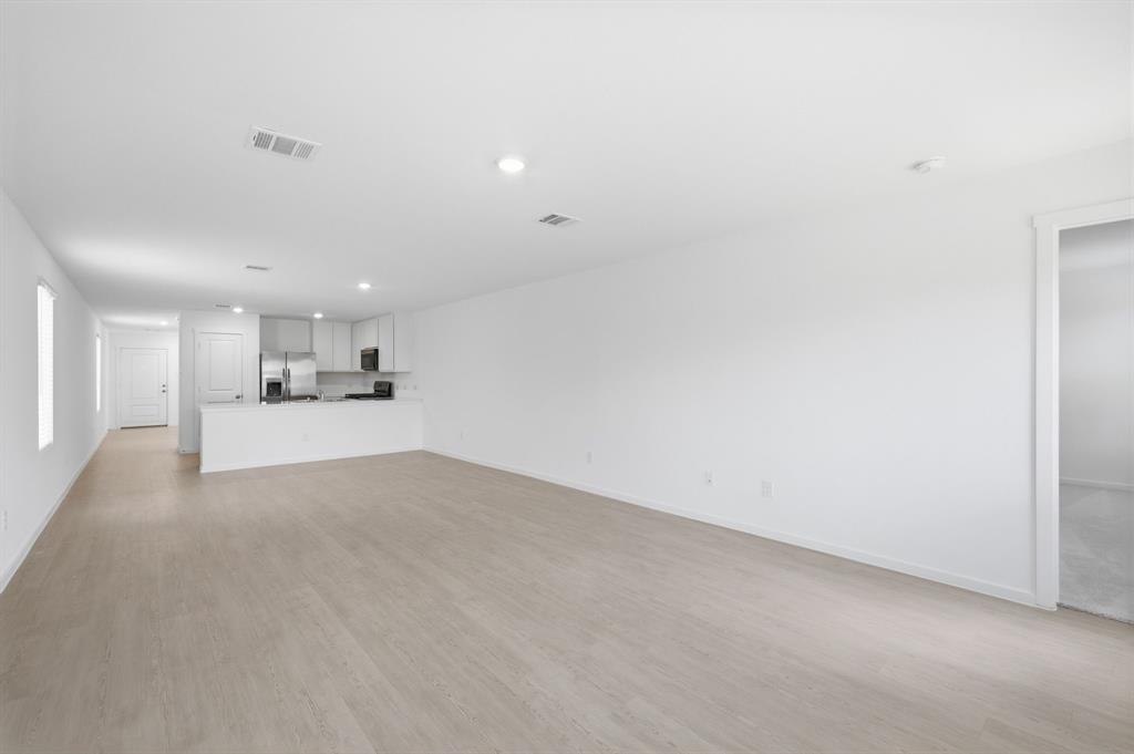 2128 Doc Holliday Road Joshua, TX 76058 - Photo 18 of 28 Open-concept living area with light wood-finish flooring