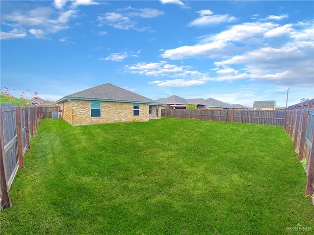 a backyard of a house with lots of green space