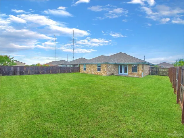 a view of a house with a big yard