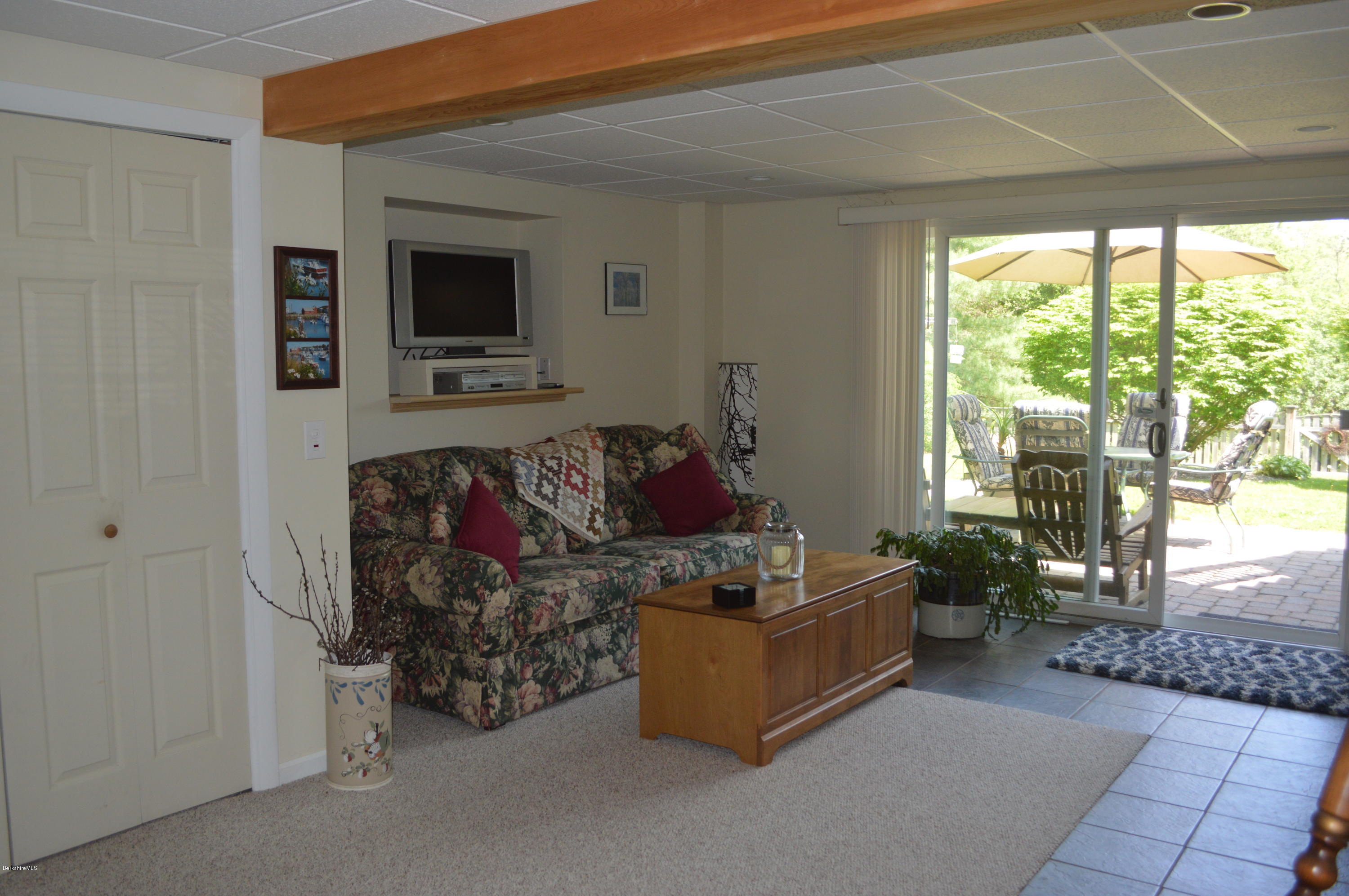 153 Lenox Road Richmond, MA 01254 - Photo 22 of 31 a living room with furniture and a flat screen tv