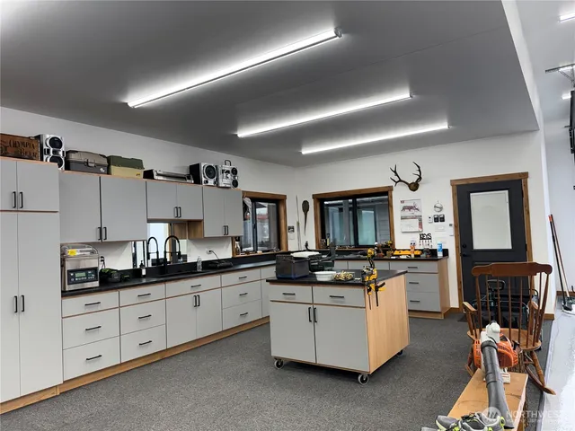 a kitchen with cabinets a sink and appliances