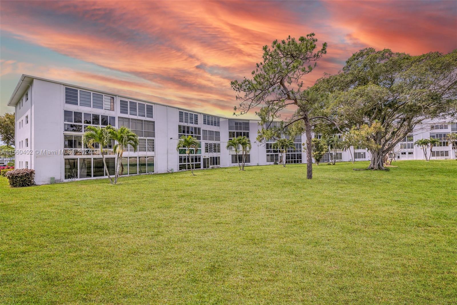 2011 Lyndhurst H, Unit 2011 Deerfield Beach, FL 33442 - Photo 26 of 35 a house view with a garden space