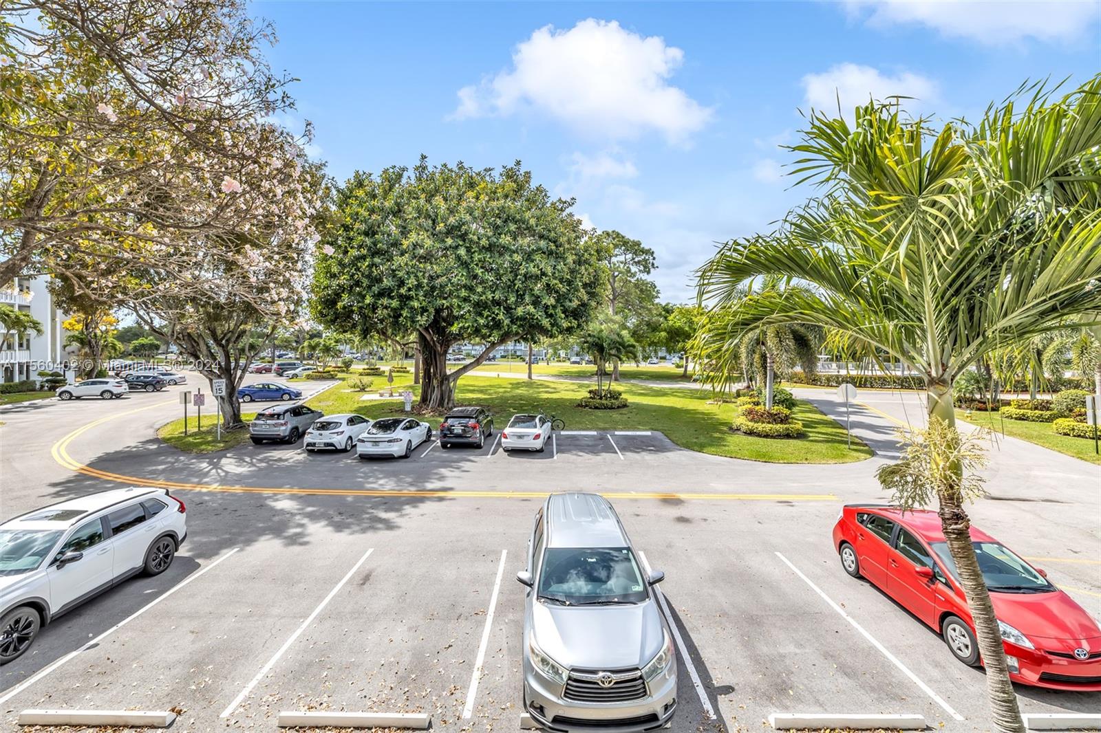 2011 Lyndhurst H, Unit 2011 Deerfield Beach, FL 33442 - Photo 3 of 35 a view of a park with swings and slides