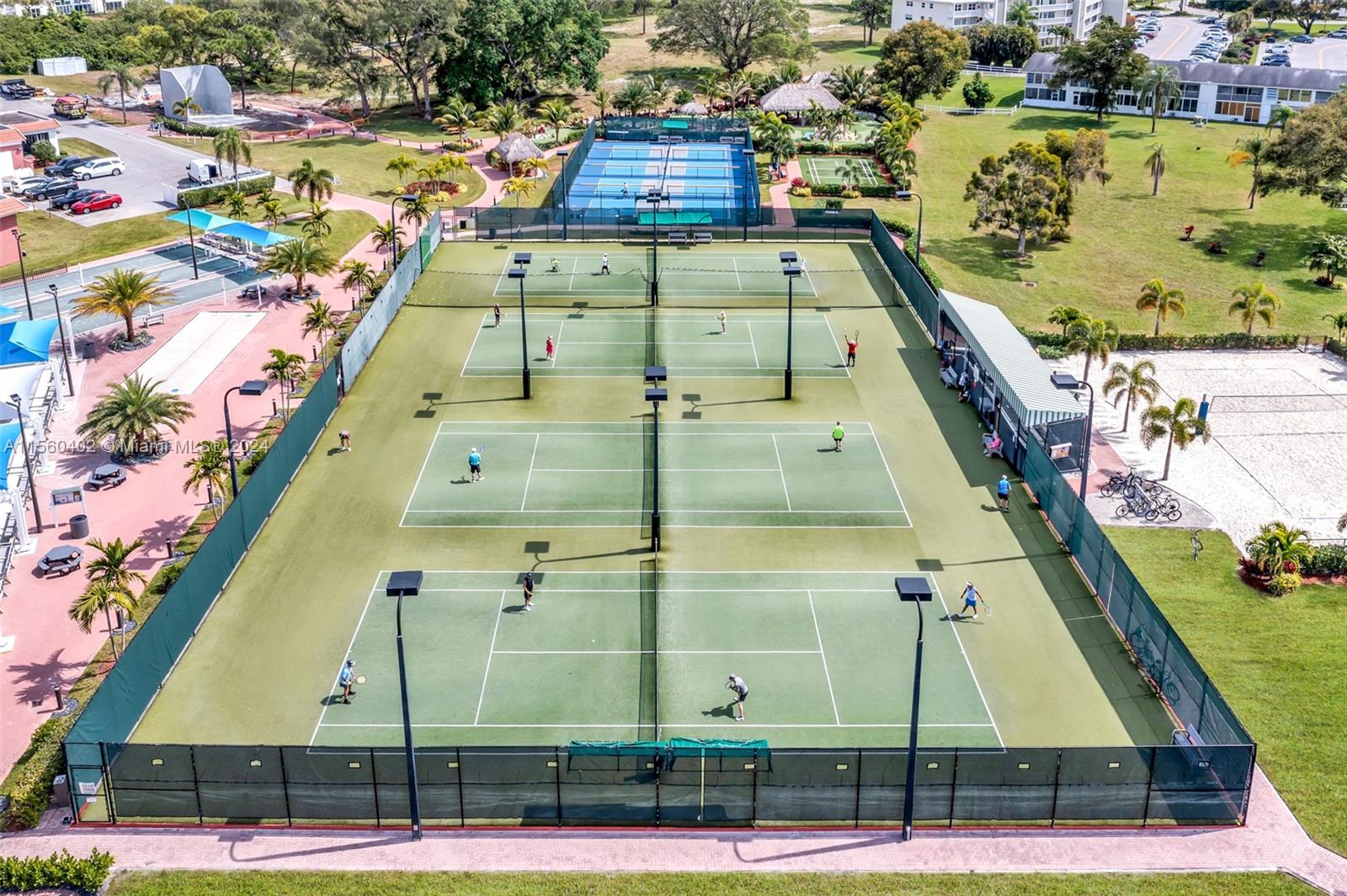 2011 Lyndhurst H, Unit 2011 Deerfield Beach, FL 33442 - Photo 33 of 35 a view of a tennis court