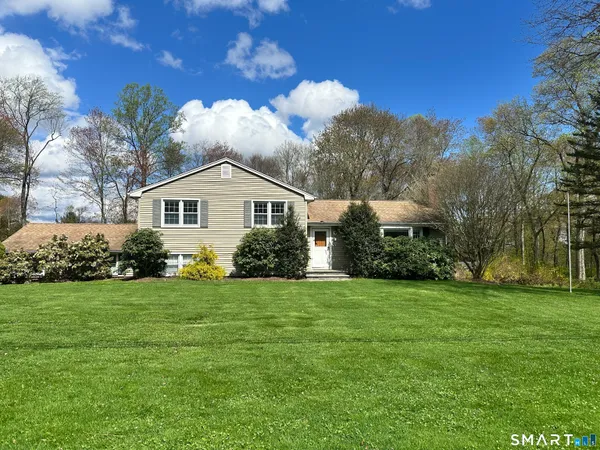 a view of a house with a yard