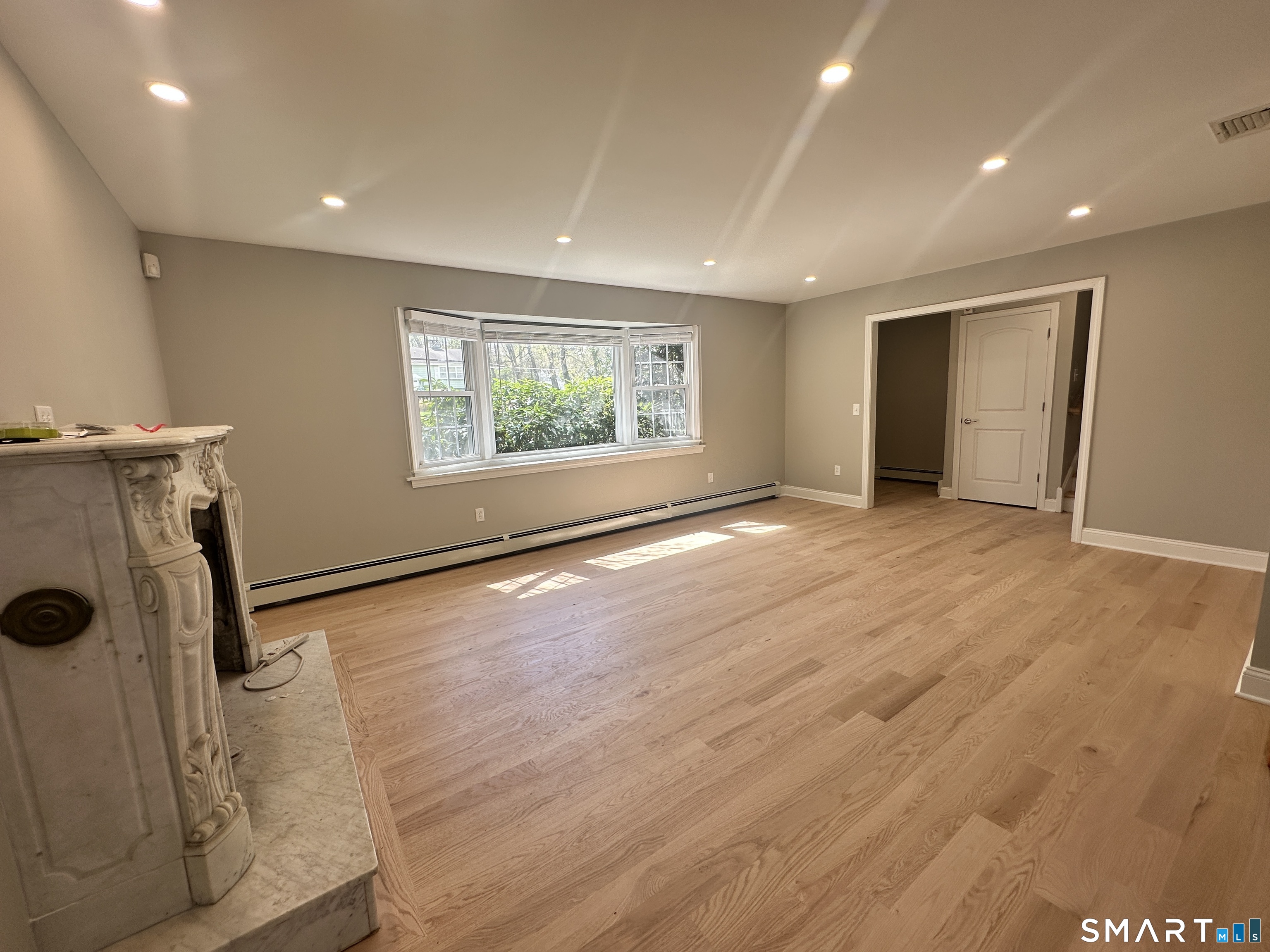 65 Gate Ridge Road Easton, CT 06612 - Photo 5 of 15 an empty room with windows dryer and washer