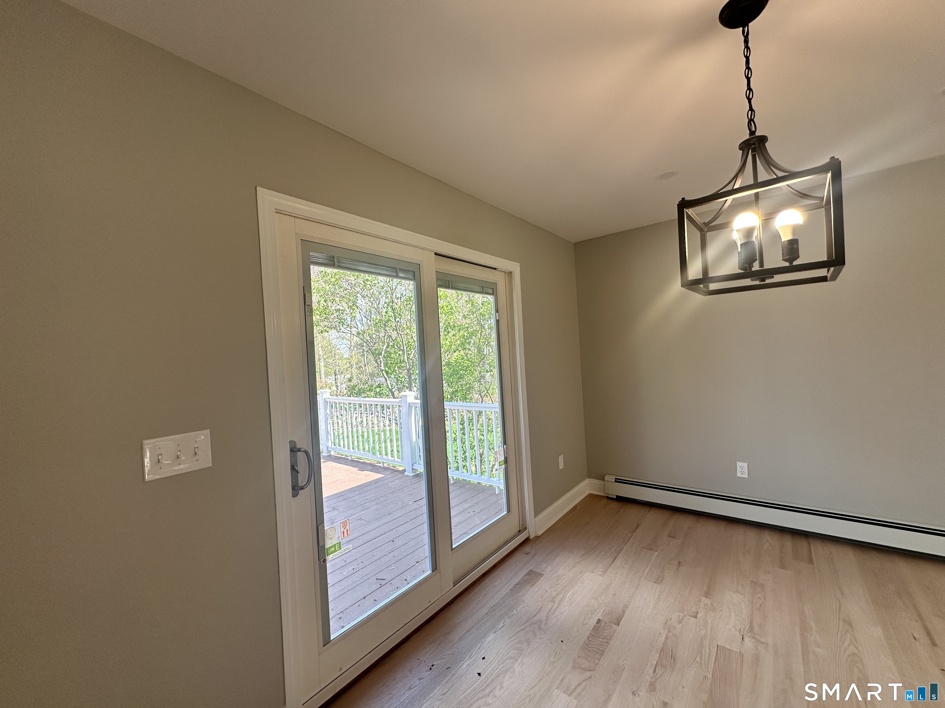 65 Gate Ridge Road Easton, CT 06612 - Photo 6 of 15 a view of a room with wooden floor and windows