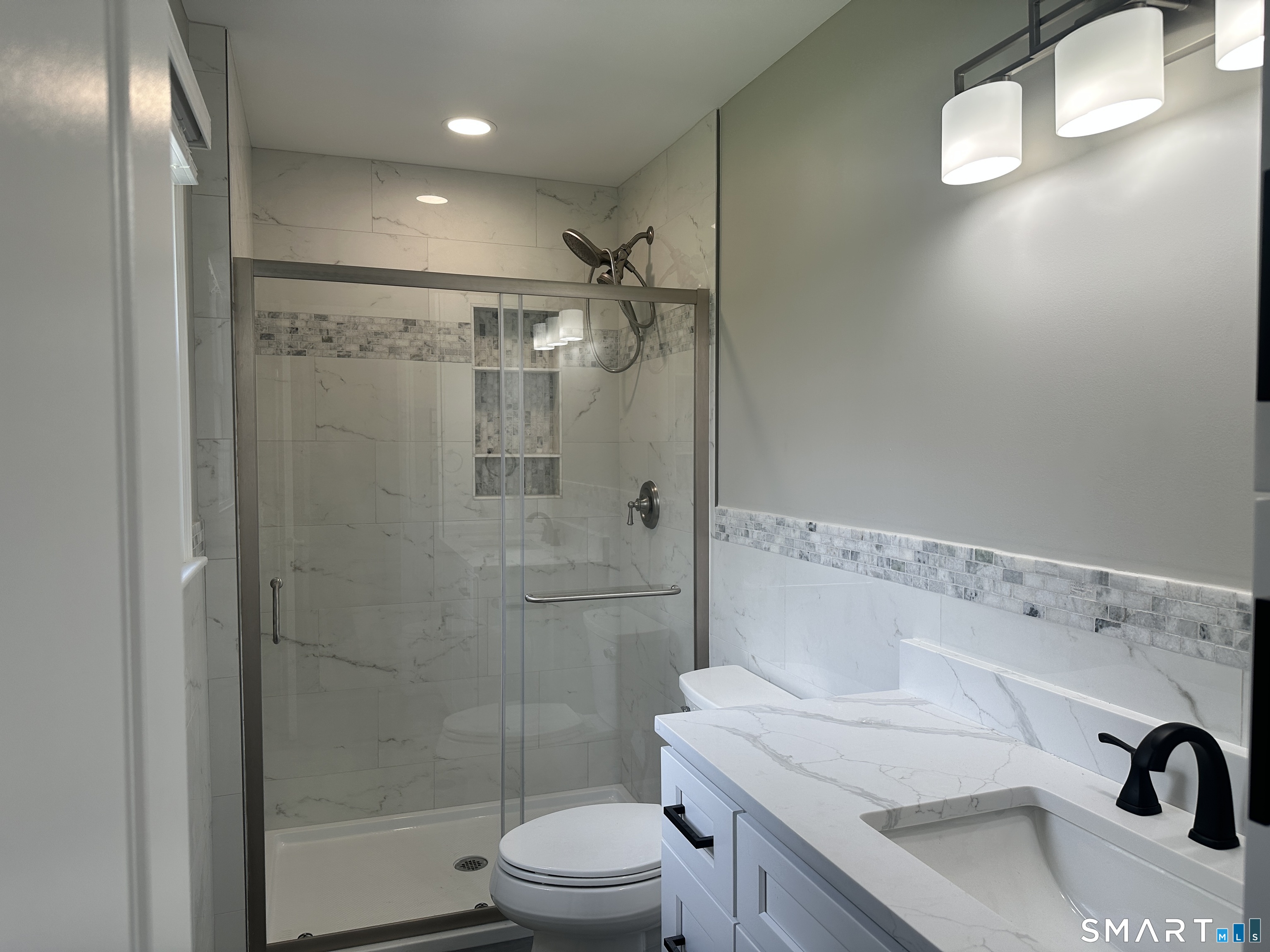 65 Gate Ridge Road Easton, CT 06612 - Photo 9 of 15 a bathroom with a sink a toilet and shower