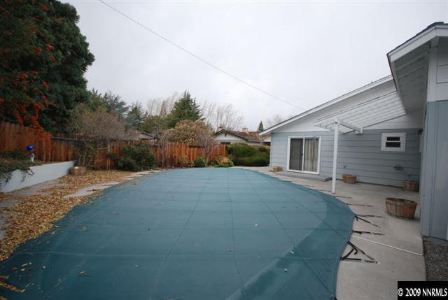 2085 Sharon Way Reno, NV 89509 - Photo 2 of 9 a view of a backyard with potted plants and a large tree