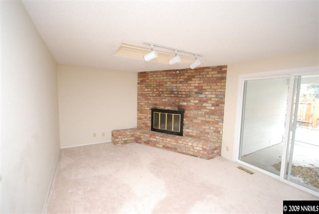 2085 Sharon Way Reno, NV 89509 - Photo 4 of 9 a view of empty room with a fireplace
