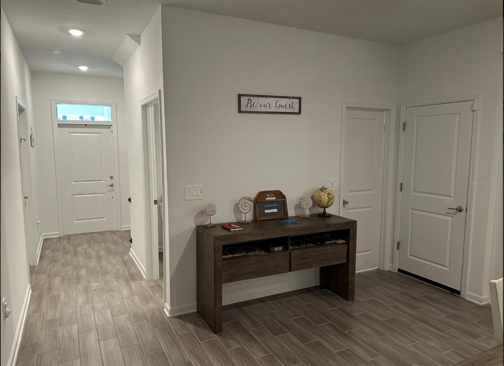 2759 Slash Way St. Cloud, FL 34771 - Photo 15 of 45 a view of room with wooden floor and closet