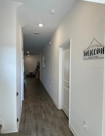 a view of a hallway with closet area