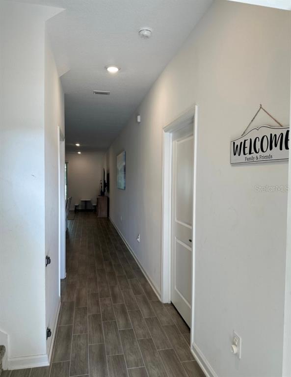 2759 Slash Way St. Cloud, FL 34771 - Photo 19 of 45 a view of a hallway with closet area