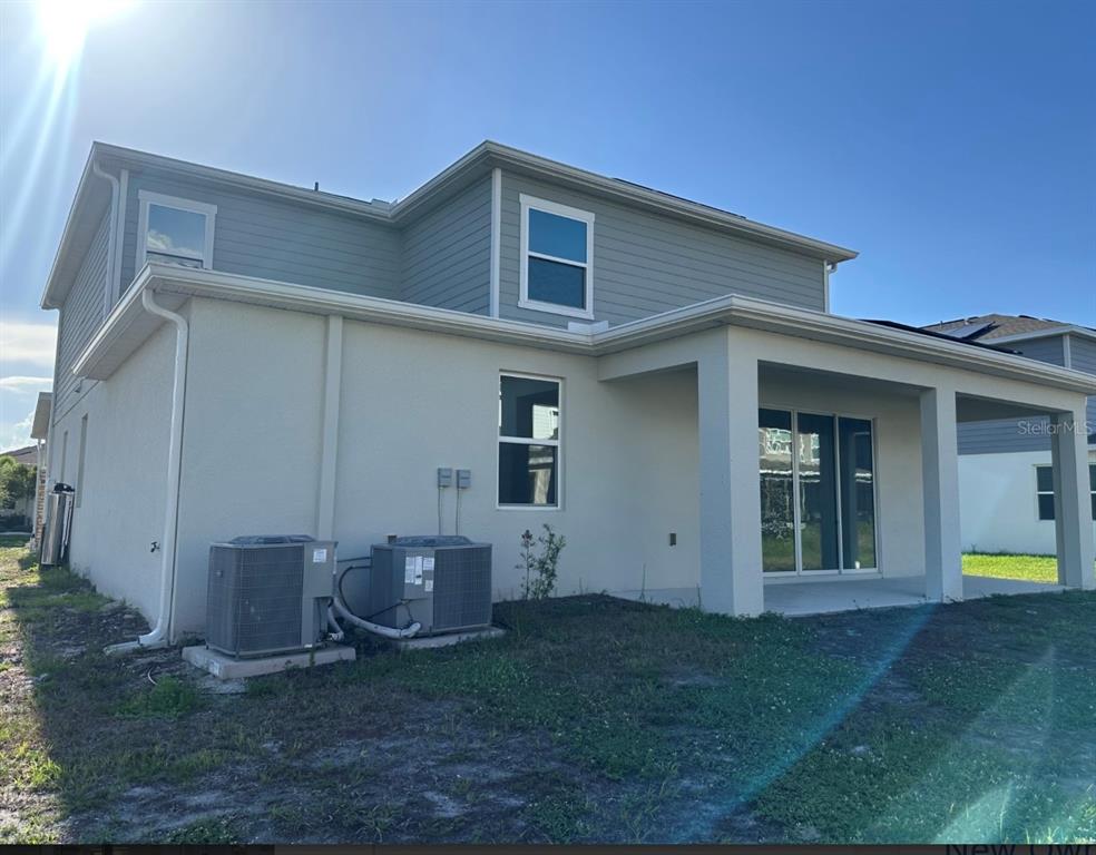 2759 Slash Way St. Cloud, FL 34771 - Photo 40 of 45 a view of a house with a yard